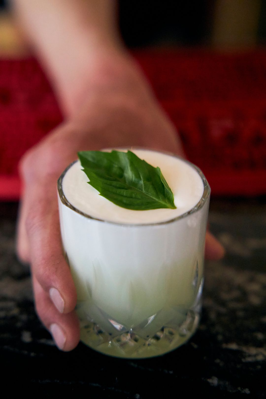 Serving a cocktail in an Aztec Cocktail Glass